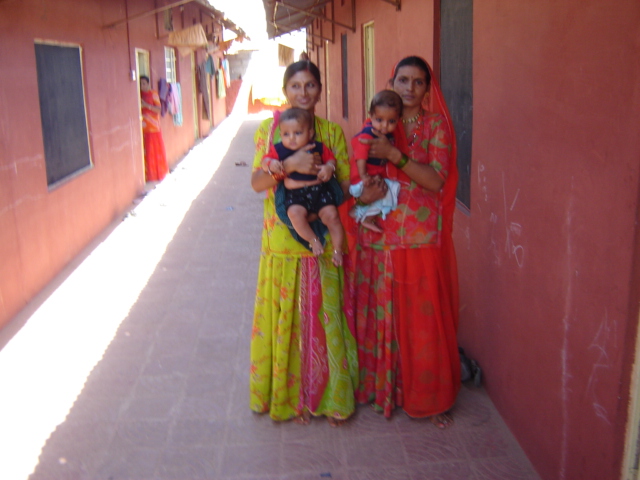 Rural mothers holding healthy infants at Meera Sansthan